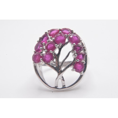 311 - x3 silver gemstone rings of pink tones, to include tree of life design, all marked 925. Sizes N/O.