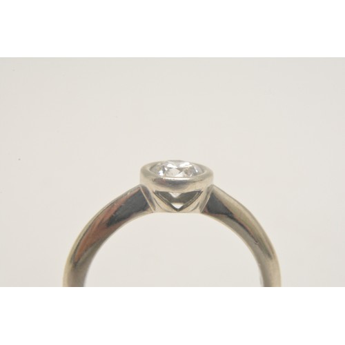 313 - Platinum solitaire ring set with a round brilliant cut diamond in a rub over setting, diamond weight... 