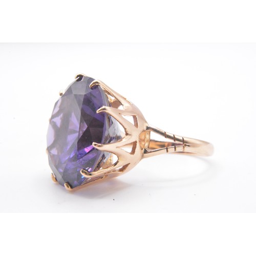 315 - Yellow gold ring, with large amethyst round cut stone in raised  mount.  stamped 14K, Approx height ... 