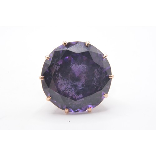 315 - Yellow gold ring, with large amethyst round cut stone in raised  mount.  stamped 14K, Approx height ... 