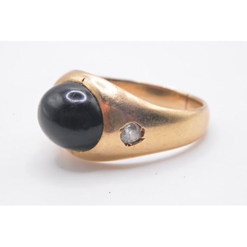 317 - Yellow gold ring with central oval cabochon stone, two small stones to mount, with touch marks. AF. ... 