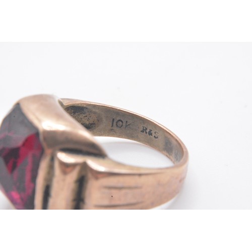 320 - Gold ring stamped 10k R&S with raised gallery design, red faceted stone, approx size M/N. approx gro... 