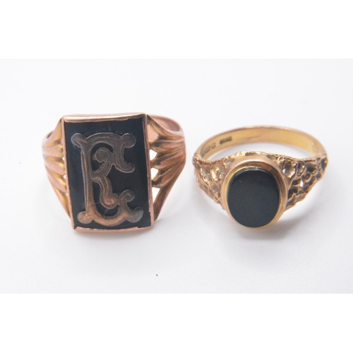 321 - x2 gent's gold/black rings, both marked 375/9ct. sizes T and P approx gross weight 8.75g