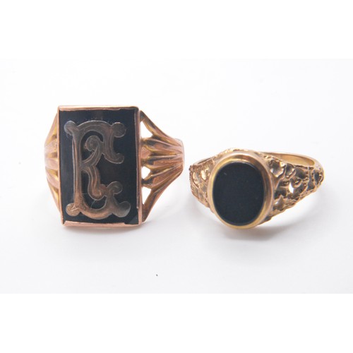 321 - x2 gent's gold/black rings, both marked 375/9ct. sizes T and P approx gross weight 8.75g