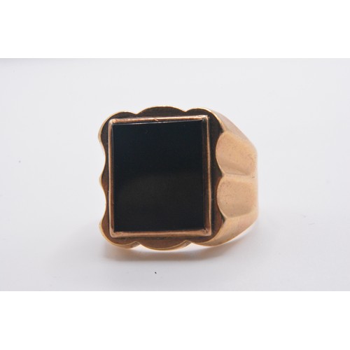 324 - 9ct gold signet ring with large rectangular black stone,  size Q gross weight approx 5.8g