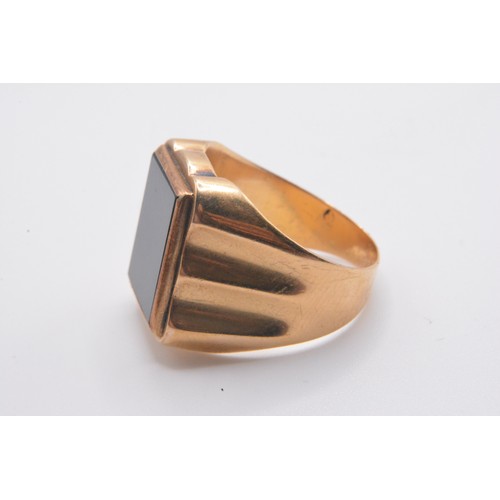 324 - 9ct gold signet ring with large rectangular black stone,  size Q gross weight approx 5.8g