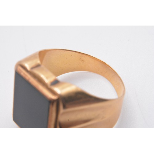 324 - 9ct gold signet ring with large rectangular black stone,  size Q gross weight approx 5.8g