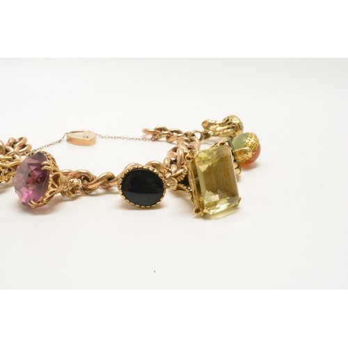 332 - Stunning 9ct gold charm bracelet with various substantial fob charms which are all gold, padlock hal... 