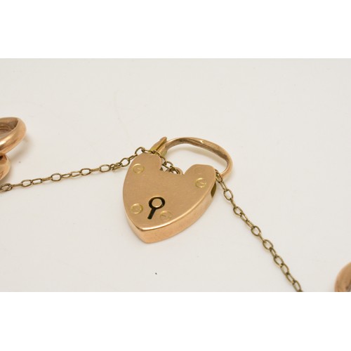 332 - Stunning 9ct gold charm bracelet with various substantial fob charms which are all gold, padlock hal... 