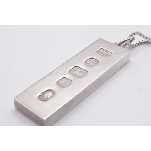 335 - Silver ingot hallmarked 1977 (Silver Jubilee year) on chain weight 35g, together with 1822 Enamelled... 