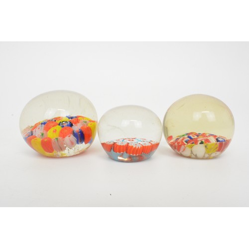 9 - A group of glass paperweights, various flower, millefiori, fish and other designs (x13)