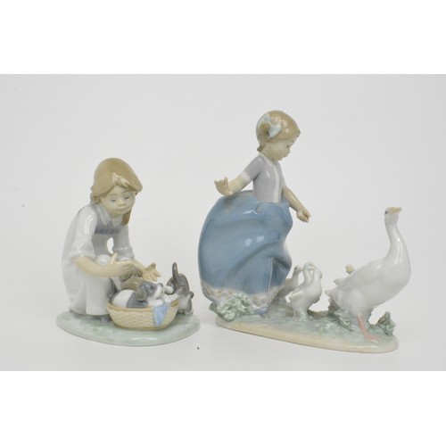 13 - Lladro figures (2) girl with geese 'Hurry Now' 5503 and girl with puppies 'Joy in a basket' model no... 