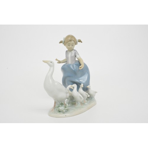 13 - Lladro figures (2) girl with geese 'Hurry Now' 5503 and girl with puppies 'Joy in a basket' model no... 