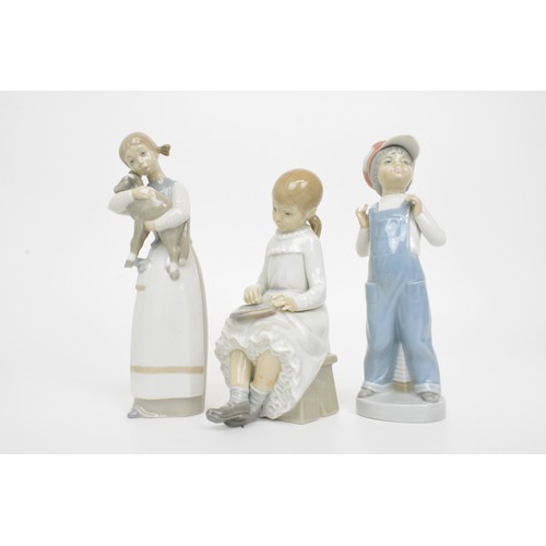 17 - Collection of Lladro (x4) and Nao figures (x2) to include girl with 3 dalmatians, painter 13.5