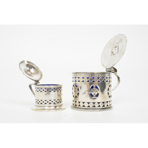 245 - Silver Mustard/sauce lidded pots with pierced design, blue liners, hallmarked Chester and London, we... 