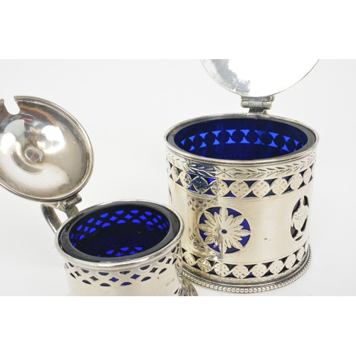 245 - Silver Mustard/sauce lidded pots with pierced design, blue liners, hallmarked Chester and London, we... 