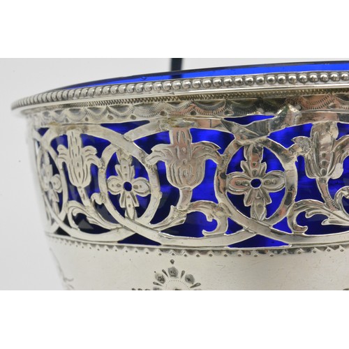 247 - Antique Silver sugar basket with blue liner.  Pierced foliate design with swags and bow engraving, h... 