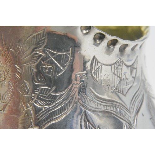 250 - Antique Silver gilt jug with engraved flower/foliate design, hallmarked London poss.c.1783. marks wo... 