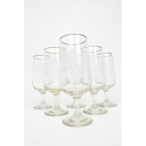 6 - Retro pitcher with glasses, together with a set of six stemmed glasses with decorative motif