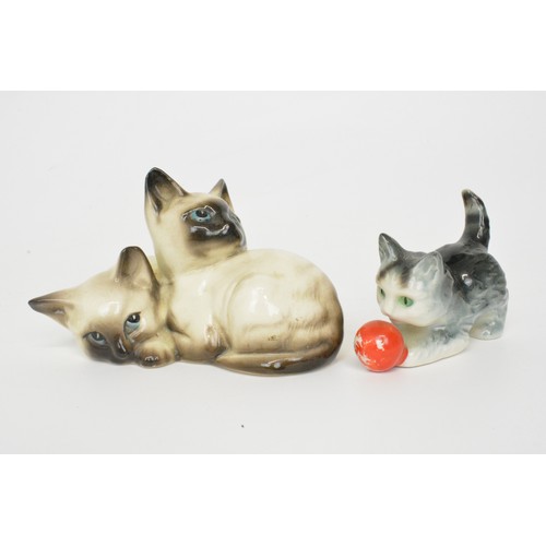 17 - Cat themed items consisting of a vintage Beswick figure of two Siamese cats snuggling, a Goebel kitt... 