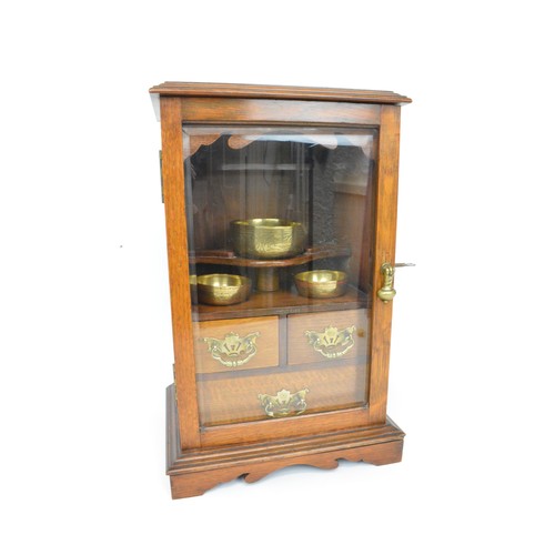 53 - Smokers cabinet, Oak cased with bevelled glass to front panel with two over one drawers with brass b... 