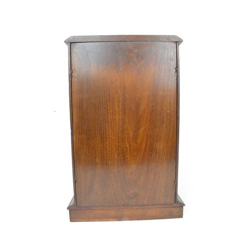 53 - Smokers cabinet, Oak cased with bevelled glass to front panel with two over one drawers with brass b... 