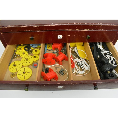 82 - Early Meccano 6 drawer cabinet  containing a large quantity of accessories and stickers and mixed in... 