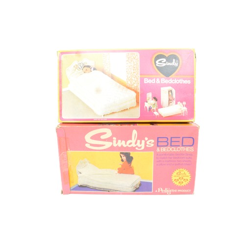 83 - Collection of Sindy Doll items to include boxed dining table + chairs. 2 x bed + bedclothes, sideboa... 