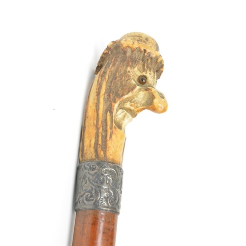 141 - Antique walking cane with carved bearded face, collar hallmarked London together with ladies Parasol... 