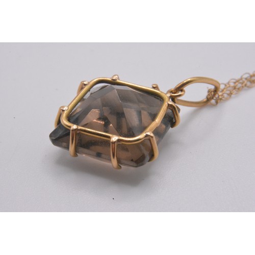 165 - Smokey quartz jewellery items consisting ring (size P) hallmarked Birmingham 375., earrings, pendant... 