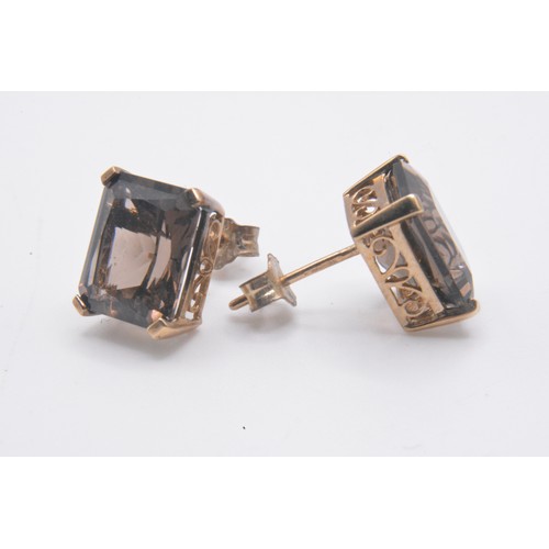 165 - Smokey quartz jewellery items consisting ring (size P) hallmarked Birmingham 375., earrings, pendant... 