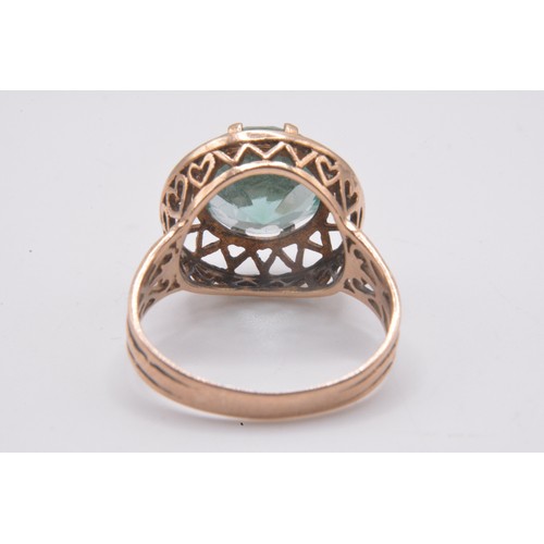 168 - 9ct yellow gold ring, green stone in claw setting with raised mount heart detailing, approx size P, ... 