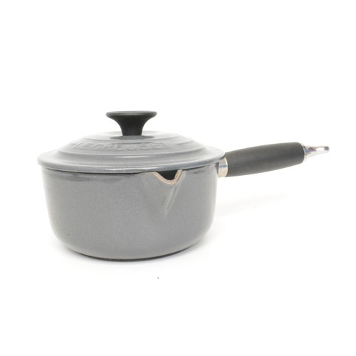 45 - Le Creuset saucepan set, with pan, heavy cast iron enamel, finished in grey/cream.