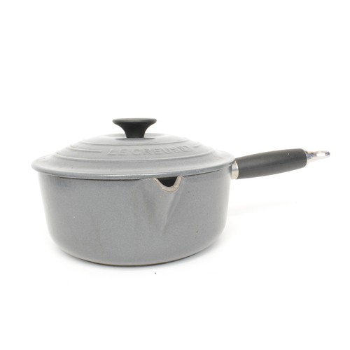 45 - Le Creuset saucepan set, with pan, heavy cast iron enamel, finished in grey/cream.