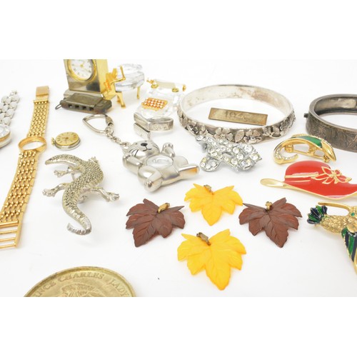 153 - A quantity of mixed costume jewellery to include some silver items, watches, medallions, etc.