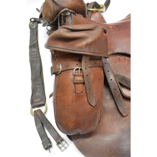 110 - H Woolley & Sons of Uttoxer military style brown leather saddle complete with saddle bags and brass ... 