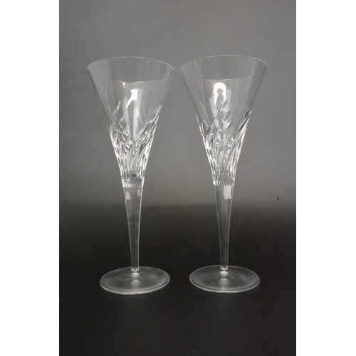 5 - Cut glass decanters together with a pair of champagne glasses