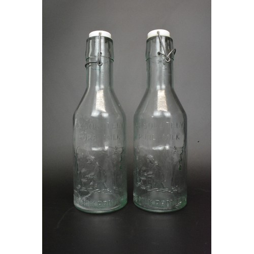 9 - A pair of Absolutely Pure Milk glass bottles