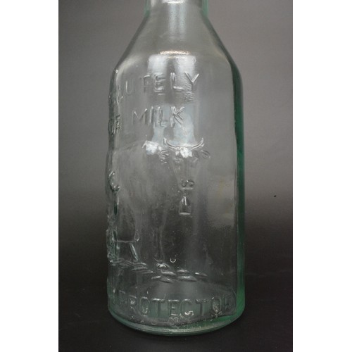 9 - A pair of Absolutely Pure Milk glass bottles