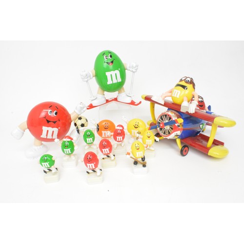 60 - Mix of novelty M&M figurines to include aeroplane, footballer and skier