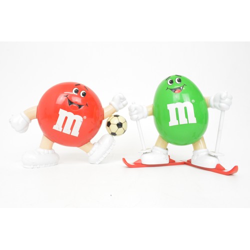 60 - Mix of novelty M&M figurines to include aeroplane, footballer and skier