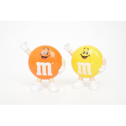 60 - Mix of novelty M&M figurines to include aeroplane, footballer and skier