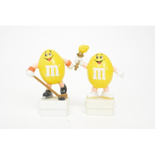 60 - Mix of novelty M&M figurines to include aeroplane, footballer and skier