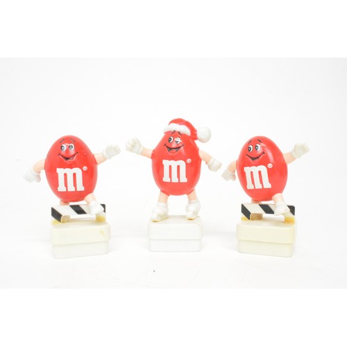 60 - Mix of novelty M&M figurines to include aeroplane, footballer and skier