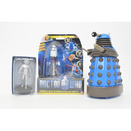 64 - Doctor Who collectibles, to include money boxes, trivial pursuit, cyber man figure, keyrings etc.