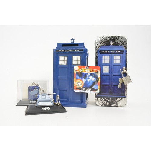 64 - Doctor Who collectibles, to include money boxes, trivial pursuit, cyber man figure, keyrings etc.