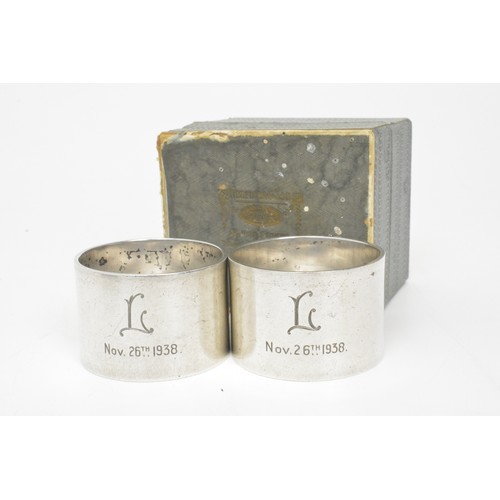 228 - Boxed pair of Viners solid silver napkin rings, hallmarked Sheffield 1937, approx gross weight 123g