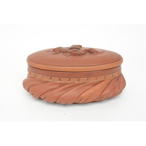 232 - Oval trinket/jewel box with decorative leather design encompassing central stone (poss.carnelian) to... 