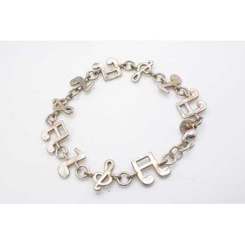 236 - 925 silver bracelet 'musical note symbols together with 925 matching ring size m/n.  together with 9... 