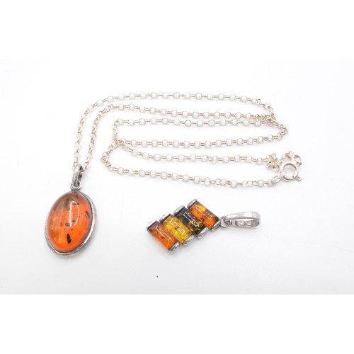 240 - 925, Italy, Silver necklace with two amber pendants one oval shaped, other graduating ambers on an 1... 